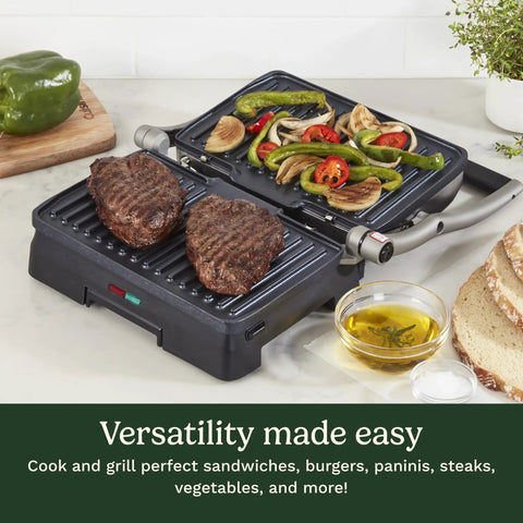 Cuisinart Griddler Indoor Grill And Panini Press With Removable Nonstick Plates grilling steaks and vegetables on a countertop.