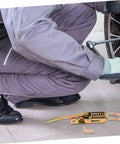 Beefy Heavy Duty Toggle Latch Clamp Kit with adjustable metal pull hasp next to mechanic working on vehicle wheel.