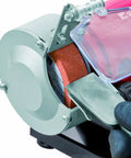 Close-up of Shop Ready Double Wheel Bench Grinder With Adjustable Spark Arresters and Heavy Duty Tool Rests in use sharpening metal.
