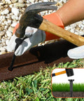 Heavy Duty 8 Inch Landscape Edging Stakes Set Of 60 for Paver Edging, showing hammer securing spiral stake in garden