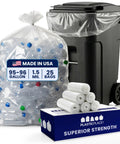Heavy Duty 95 To 96 Gallon Clear Trash Bag Liners 1.5 Mil Thick jumbo rollaway bin sacks in a pack by a trash bin.
