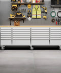 96 Inch Rolling Tool Chest With 24 Drawers, Solid Rubber Wood Work Surface, Locking Wheels And Keyed Lock, Silver shown in garage setup