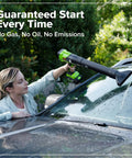 Woman using a green and black 270 CFM electric leaf blower on a car windshield to clean dirt, showcasing Tackle Stubborn Weeds Fast With This Heavy Duty 24V Brushless String Trimmer And 270 Cfm Electric Leaf Blower Combo Plus Reliable 20 Ah Battery Pack For Epic Yard Hustle.