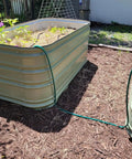 Raised garden bed with Customizable Soaker Hose System With 50 Ft 1/2 Inch Soaker Hose And 25 Ft PVC Garden Hose seen in use