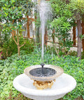 Sun Powered Bird Bath Fountain Pump 1.5W for garden patio pond, floating water pump in sunlight, gentle spray over plants