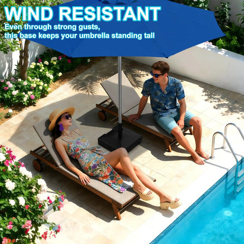 Heavy Duty 120Lb Fillable Umbrella Base With Wheels And Handle next to poolside loungers, offering shade from large blue umbrella.