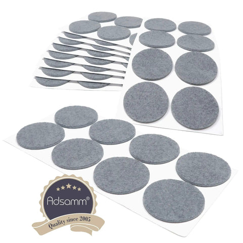 Pack Of Eighty Self Adhesive Felt Pads Grey Round One Point Nine Seven Inches stacked on sheets, ideal for protecting furniture.