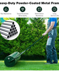 Person using Heavy Duty Lawn Roller Drum For Push Or Tow Behind Tractor, Rust Resistant Powder Coated Metal Frame, Ideal For Garden Yard Park And Farm Maintenance, Sod Flattening And Lawn Leveling Green on grass