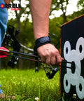 Archer using Yellow Jacket Dual Threat Foam Archery Target Block Up To 350 FPS For Compound Bows And Crossbows in a field.