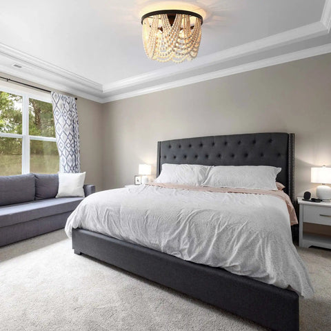 Farmhouse Boho Flush Mount Ceiling Light Three Light Wood Bead Chandelier Black Metal Hanging Pendant in cozy bedroom setting.