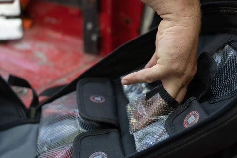Close-up of open ToolPack Pro Backpack for Roofers, Electricians, Data Techs, Glaziers, Handymen with hand accessing pocket