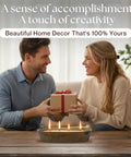 Couple sitting at table with Sand Candle Kit With 24 Wicks And Ivory Pearled Wax Beads 1 Pound Includes Wood Holder
