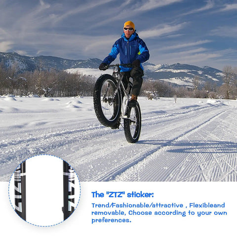 Cyclist with Fat Tire 26x4.0 Inch MTB Air Suspension Fork on snow, showcasing balance and performance.