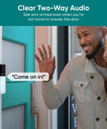 Wireless Video Doorbell Pro With 1440 HD Video, Night Vision, 2-Way Audio, And One-To-One Head-To-Toe View installed by a front door.