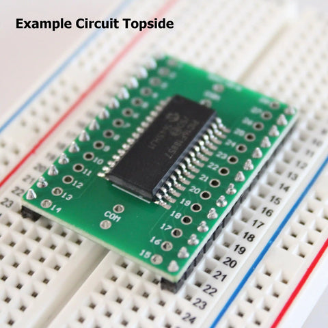 SMD To DIP Breakout PCB Module With SOIC 28 To DIP Adapter on breadboard, dual row header, integrated SMT resistor and capacitor pads.