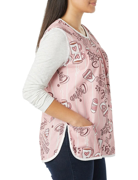 Hassle Free Snap Front Cobbler Apron Vest With Dual Patch Pockets Top Shelf Easy Care Smock in pink, worn by a woman, side view.