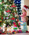 Children decorating Christmas tree with 3 Pack Vintage Red Truck Ornaments With Mini Christmas Trees Handcrafted Metal Car Model