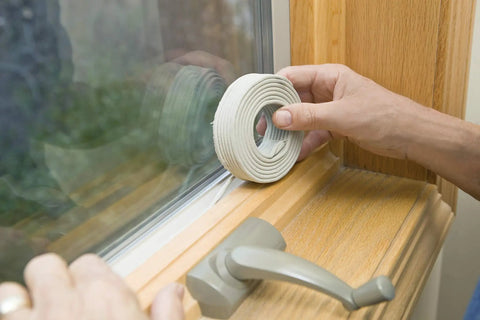 Applying Fingertip Caulking Cord 1/8 Inch By 90 Feet Grey to window frame for weatherproof seal, no caulking gun needed.