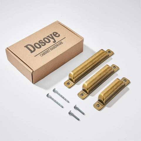 Heavy Duty 10 Pack Of Three Inch Antique Brass Cabinet Pulls With Slick Zinc Alloy Build and Tight Screw Placement For Kitchen Drawers, showing three pulls and packaging.