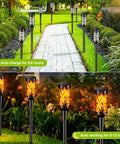 Solar Powered Outdoor Lights For Yard And Garden Black LED Path Lights Waterproof And Weatherproof No Fuss Setup Auto On At Dusk Energy Saving Night Lighting For Patio Walkway And Porch illuminating walkway and garden with floral pattern by day and flame effect by night.