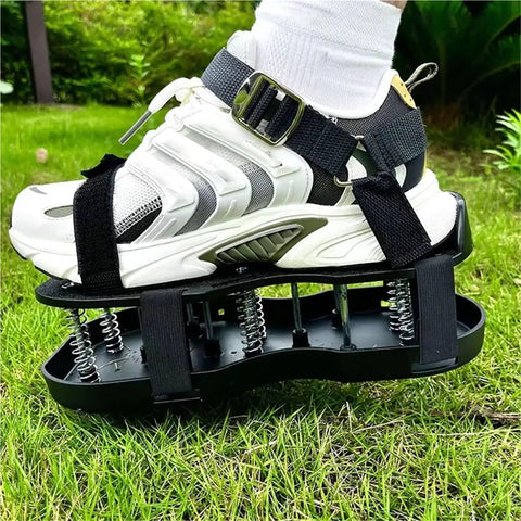 Person wearing Double Layer Grass Aerator Shoes For Lawn Care With Adjustable Straps Spiked Sandals, standing on grass.