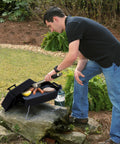 Man grilling on Portable Propane Gas Grill With Convective Heat, One Burner, 190 Square Inches Of Cooking Space for camping