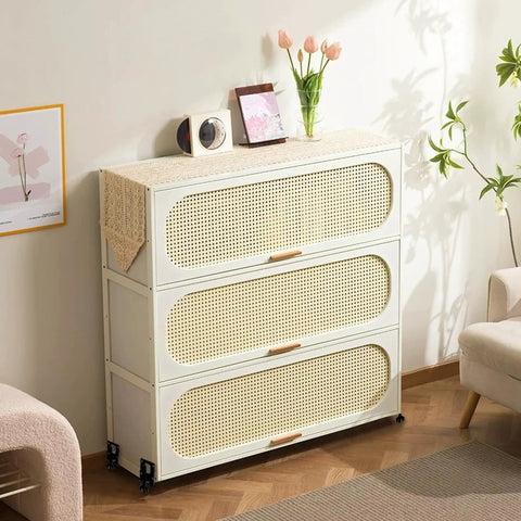 Wooden woven-front dresser in living room with decor, plants, and parquet floor.