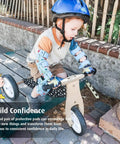 Child wearing kid friendly knee and elbow pad set with pro grade bike gloves for ages 2-11, riding a balance bike