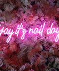 Pink Neon Nail Sign For Nail Salon And Beauty Studio Decor LED Light Open Sign Wall Art Perfect For Nail Rooms, Beauty Bars, Spas, Shops, And Home Makeovers displayed over floral background