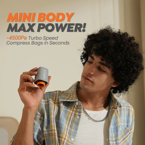 Person holding a grey and orange pump from Cordless Vacuum Storage Bags 20 Pack With Rechargeable Wireless Pump Portable Space Saver.