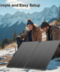 200 Watt Foldable Solar Panel Kit Delivering Top Shelf 23.5 Percent Efficiency And Ultra Light Tempered Glass Tied To A Rock Solid Pwm Controller With Ip68 Waterproof Rating For Road Trip Ready Rv Adventures And Off Grid Camping Power in use outdoors with two people and mountains.