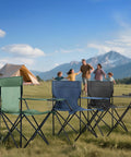 Three foldable camping chairs set on grass, against a mountain backdrop, featuring the Two Pack Foldable Camping Chairs with Cup Holder.