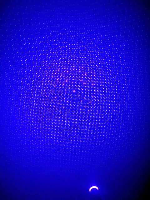 USB Star Projector Night Light With Adjustable Romantic Sky Projection shining blue stars on ceiling