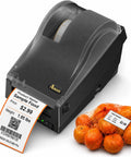 Direct Thermal Label Printer 2 Inch Wide For Barcode Stickers And QR Codes printing a label next to a bag of oranges.