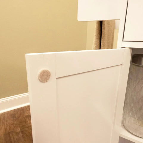 Three-Eighths Inch Round Mini Self-Stick Furniture Felt Pads For Hard Floors installed on cabinet door