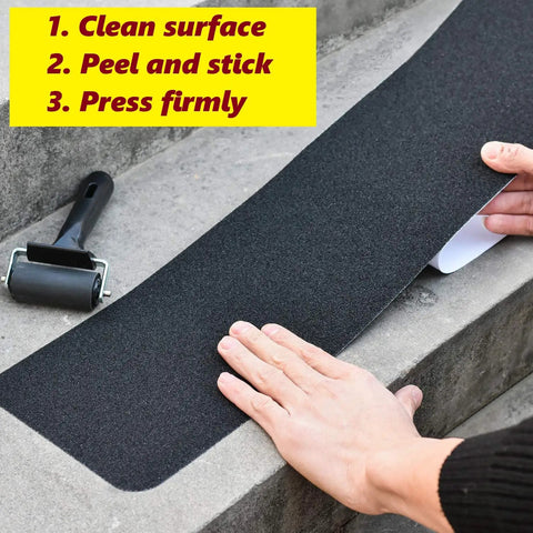 Applying Self Adhesive Non Slip Stair Tread Tape 15 Pack Pre Cut 32 By 6 Inch Black Stair Step Strips Anti Slip Traction Tape by hand.
