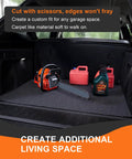Car trunk with heavy duty oil spill mat, chainsaw, red fuel canisters, and oil bottle inside, showcasing storage use.