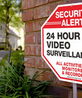 Tough As Nails Security Signs Octagon 12 By 12 Inch Aluminum Sign 40 Mil Thick Reflective For Home And Business CCTV Video Surveillance UV Protected And Waterproof 4 Pack displayed on a brick wall.