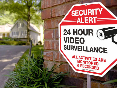 Tough As Nails Security Signs Octagon 12 By 12 Inch Aluminum Sign 40 Mil Thick Reflective For Home And Business CCTV Video Surveillance UV Protected And Waterproof 4 Pack displayed on a brick wall.