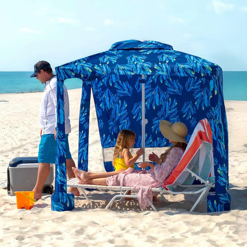 Beach Cabana Canopy 6.5 Feet By 6.5 Feet, Easy Set Up And Take Down, Portable Sun Shade With Sand Pockets And Side Wall, Water Resistant Beach Shelter In Coral Tropical providing shade on a sandy beach