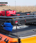 SINOKING rubber clamp for mounting tools and equipment, 2.5–7.5 in diameter, mounted on pickup bed rack.