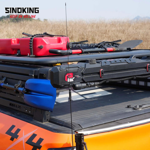 SINOKING rubber clamp for mounting tools and equipment, 2.5–7.5 in diameter, mounted on pickup bed rack.