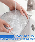 Hands rinsing Heavy Duty Non Scratch Steel Wool Dishcloths And Scrubber Pads Kitchen Cleaning Set under running water.