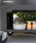 Lower view of 120-Qt Rolling Ice Chest Cooler Cart With Wheels And Drink Dividers, showing storage shelf with cans and dish