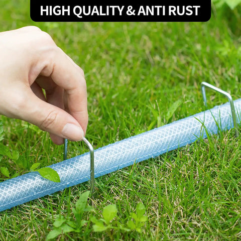 Using Heavy Duty 6 Inch U-Shaped Landscape Staples Set, 120 Pack, 11 Gauge Galvanized Steel Garden Stakes to secure fabric on grass