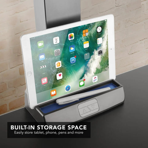 Heavy Duty Electric Standing Desk Converter With Monitor Mount And Wide Keyboard Tray featuring a built-in storage space for devices.
