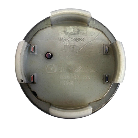 Back view of Mazda KD51-37-190 Center Cap OEM Genuine Factory Replacement For All Alloy Wheels, durable plastic clips visible