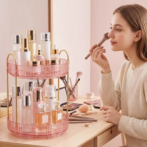 Total Game Changer, 360 Rotation Makeup Organizer For Vanity Desk holding beauty products on a pink two-tier tray.