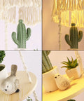 Close-up of a decorative scene with a macrame hanging light next to a potted cactus and bird ornaments, warm glow ambiance.