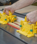 Kickback Buster 3D Push Block With Gravity Heel Kit For Table Saws in use, holding lumber on a table saw with precision.